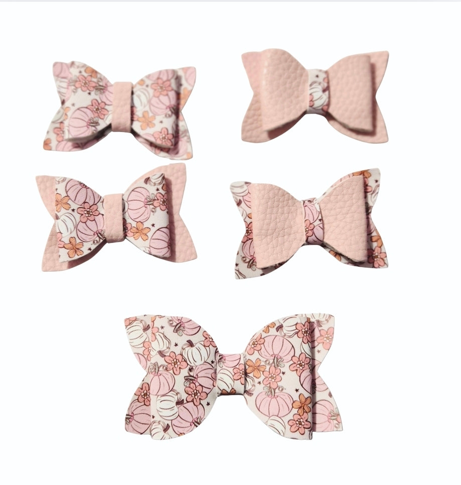 Handmade 5-piece mini faux leather pumpkin and floral hair bow set for babies, toddlers, and girls in coordinating blush pink fall colors.