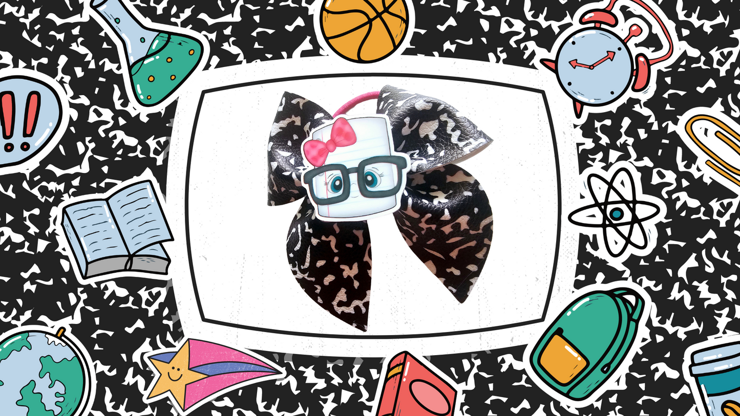 Handmade school notebook ponytail holders for girls featuring notebook-inspired designs, perfect for back-to-school outfits, picture day, and everyday school wear.