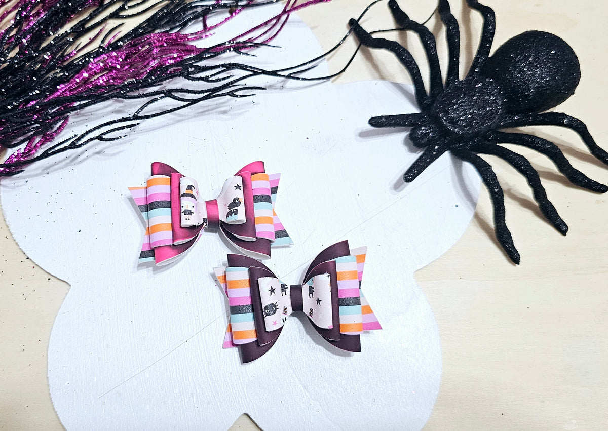 Mini handmade Halloween hair bow featuring heat-changing faux leather, available on an alligator clip or headband.