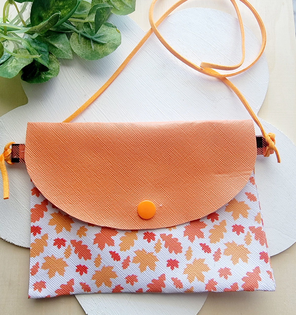 Girls' handmade fall accessory bundle with orange autumn leaf purse and matching orange plaid hair bows.