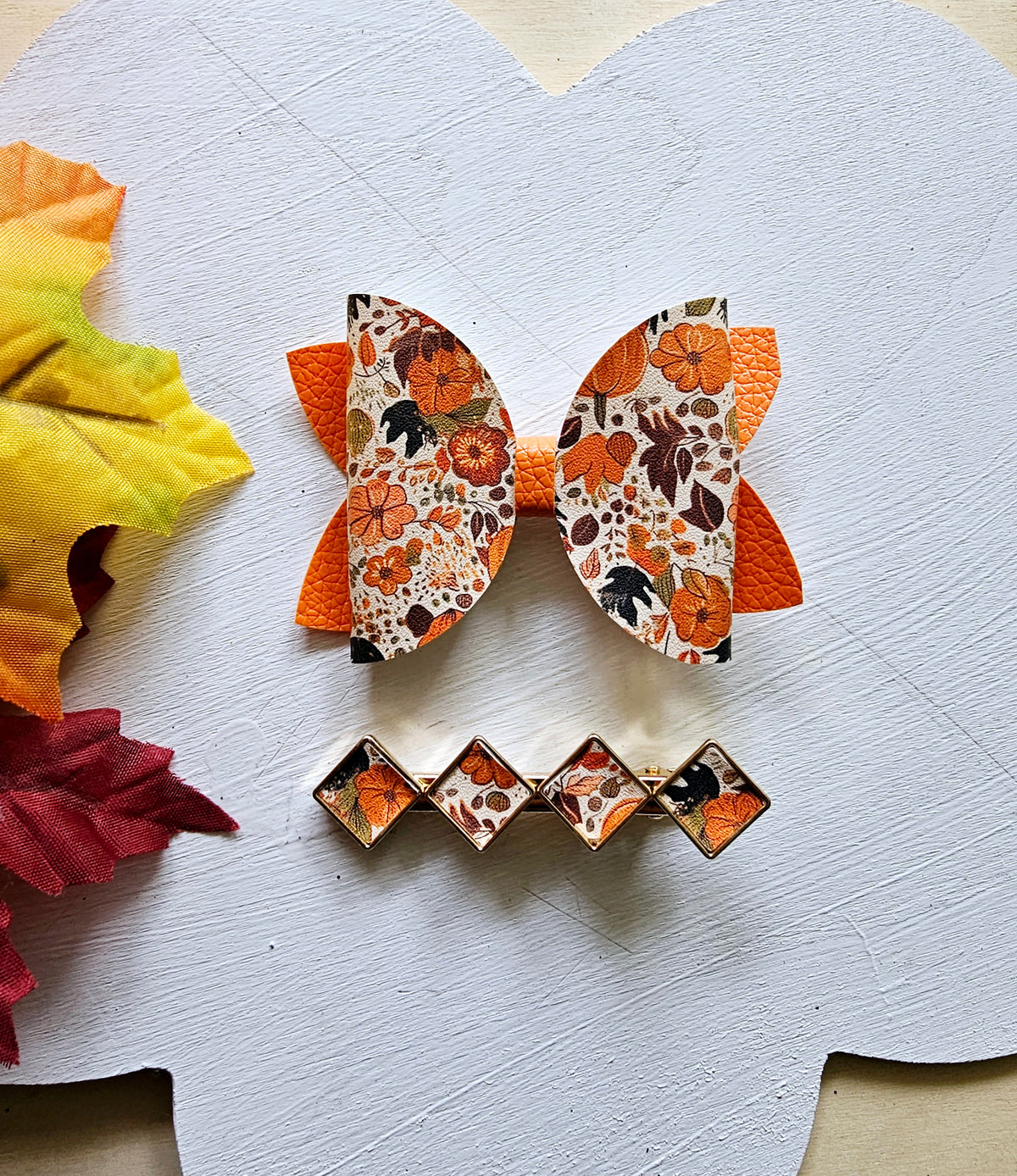 Handmade fall hair accessory set featuring one small faux leather boutique hair bow with four matching autumn snap clips for babies, toddlers, and girls.