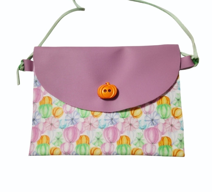 Handmade faux leather pumpkin purse for girls in pastel fall colors with an adjustable crossbody strap.