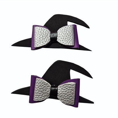 Two handmade Halloween witch hat hair bows with black witch hats, silver glitter bows, and purple accents for babies, toddlers, and little girls.