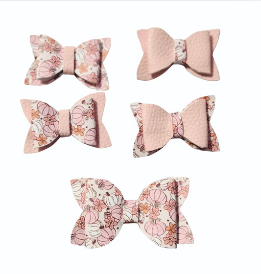 Handmade 5-piece mini faux leather pumpkin and floral hair bow set for babies, toddlers, and girls in coordinating blush pink fall colors.