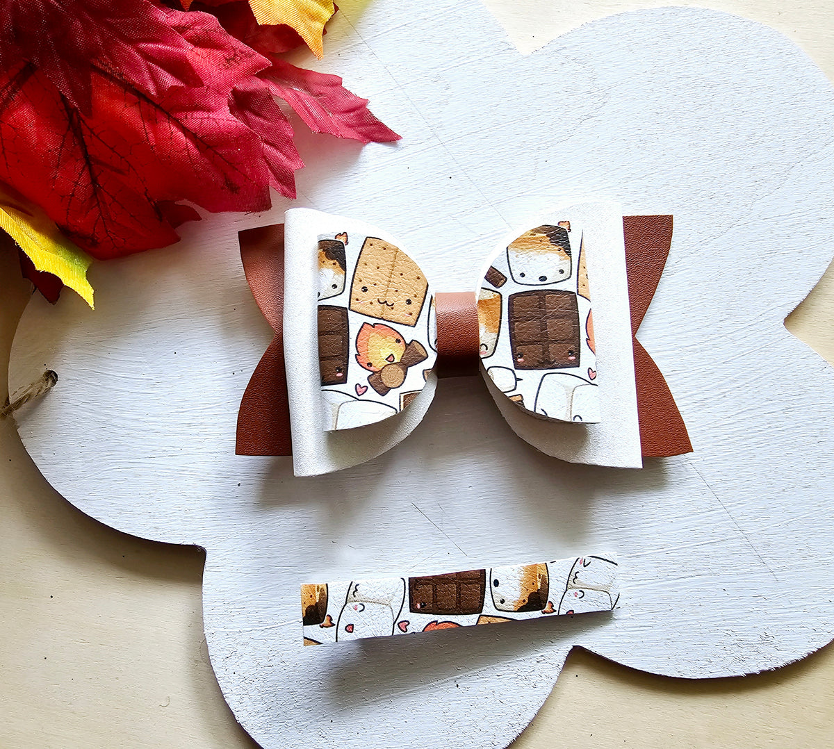 Handmade Sweet S'mores faux leather hair bow with matching snap clip featuring a cozy campfire marshmallow print for babies, toddlers, and girls.