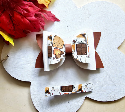 Handmade Sweet S'mores faux leather hair bow with matching snap clip featuring a cozy campfire marshmallow print for babies, toddlers, and girls.