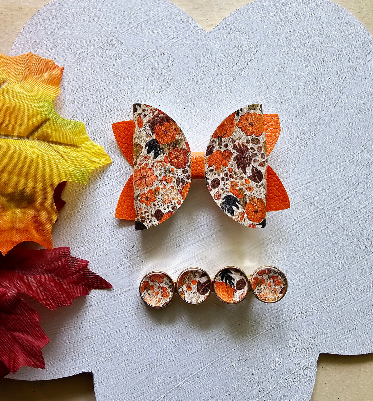 Handmade fall hair accessory set featuring one small faux leather boutique hair bow with four matching autumn snap clips for babies, toddlers, and girls.