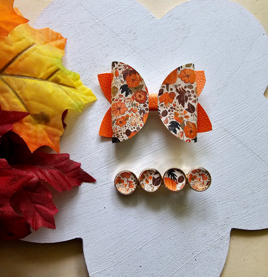 Handmade fall hair accessory set featuring one small faux leather boutique hair bow with four matching autumn snap clips for babies, toddlers, and girls.