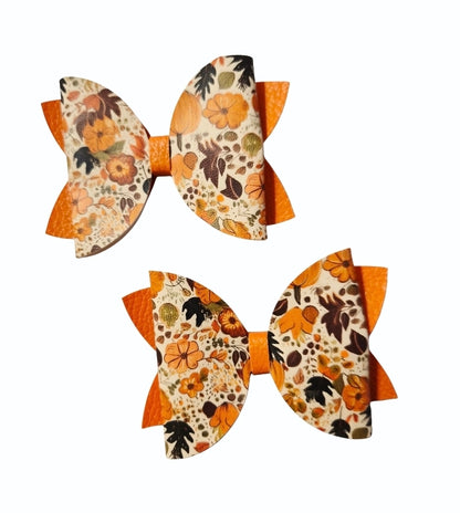 Handmade fall hair accessory set featuring one small faux leather boutique hair bow with four matching autumn snap clips for babies, toddlers, and girls.