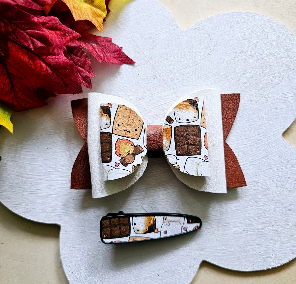 Handmade Sweet S'mores faux leather hair bow with matching snap clip featuring a cozy campfire marshmallow print for babies, toddlers, and girls.