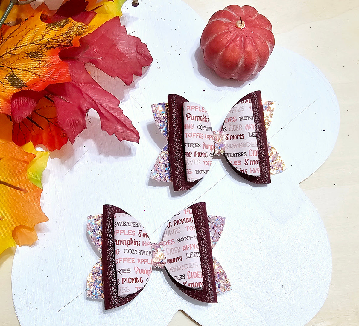 Handmade All Things Fall faux leather boutique hair bow with cozy autumn print for babies, toddlers, and girls.