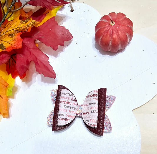 Handmade All Things Fall faux leather boutique hair bow with cozy autumn print for babies, toddlers, and girls.