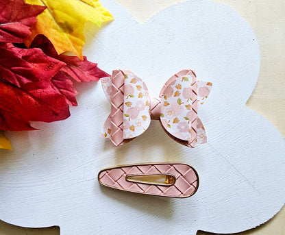 Handmade Apple Picking faux leather hair bow with matching blush pink snap clip featuring an apple print for babies, toddlers, and girls.