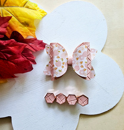 Handmade Apple Picking faux leather hair bow with matching blush pink snap clip featuring an apple print for babies, toddlers, and girls.