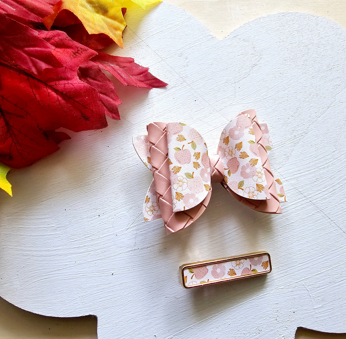 Handmade Apple Picking faux leather hair bow with matching blush pink snap clip featuring an apple print for babies, toddlers, and girls.