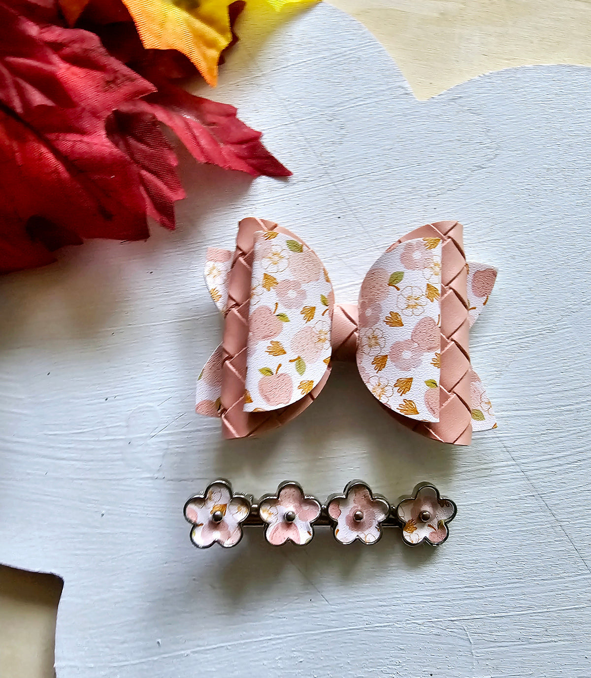Handmade Apple Picking faux leather hair bow with matching blush pink snap clip featuring an apple print for babies, toddlers, and girls.