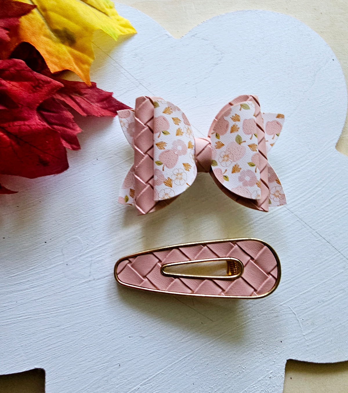 Handmade Apple Picking faux leather hair bow with matching blush pink snap clip featuring an apple print for babies, toddlers, and girls.