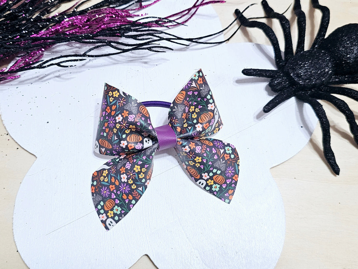 Boutique Halloween ponytail holder with a spooky floral print, perfect for fall and Halloween outfits.