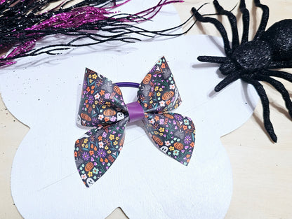 Boutique Halloween ponytail holder with a spooky floral print, perfect for fall and Halloween outfits.