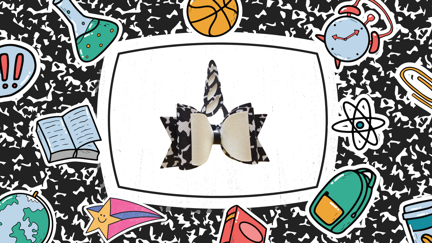 Handmade composition notebook unicorn hair bow for girls, perfect for back-to-school outfits, picture day, and unicorn lovers.