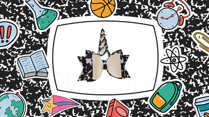Handmade composition notebook unicorn hair bow for girls, perfect for back-to-school outfits, picture day, and unicorn lovers.