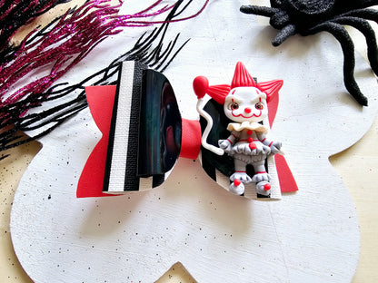 Handmade Scary Clown Halloween hair bow featuring glitter accents and a detailed creepy clown centerpiece for girls.