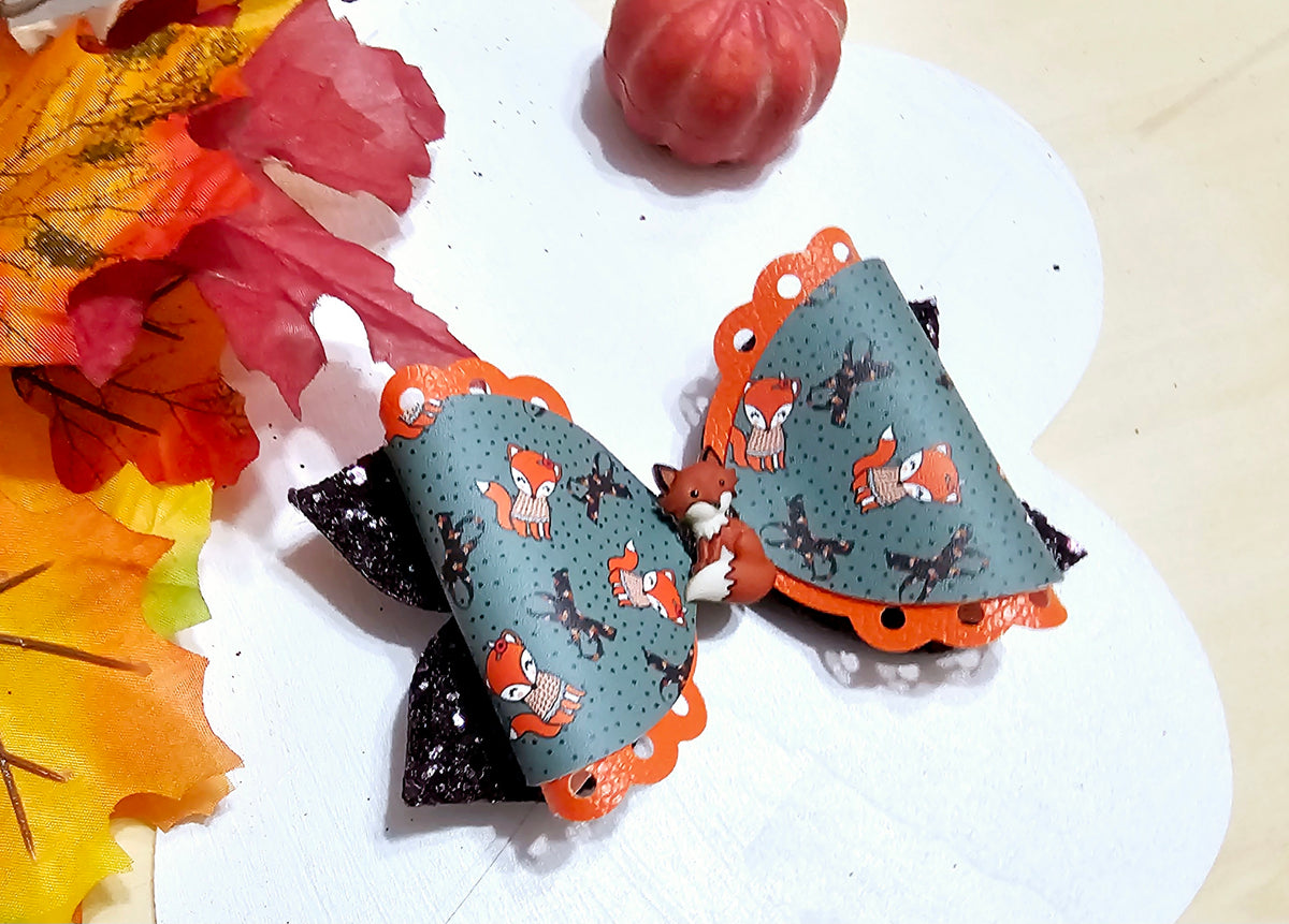 Handmade Fox in the Fall faux leather boutique hair bow with woodland fox print for babies, toddlers, and girls.