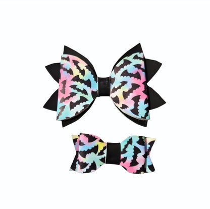 Handmade pastel bat Halloween hair bows for girls, toddlers, and kids.