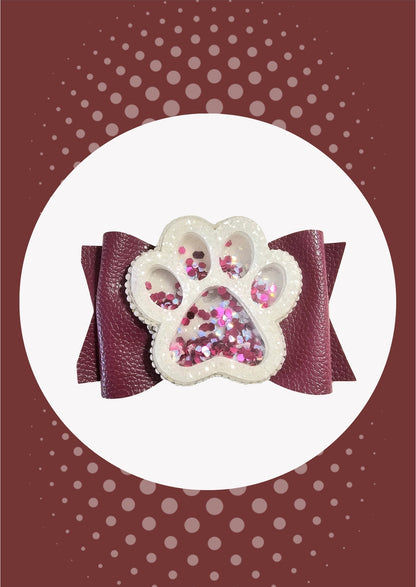 Handmade glitter paw print hair bow for girls, perfect for school spirit events, pep rallies, sporting events, and cheer.