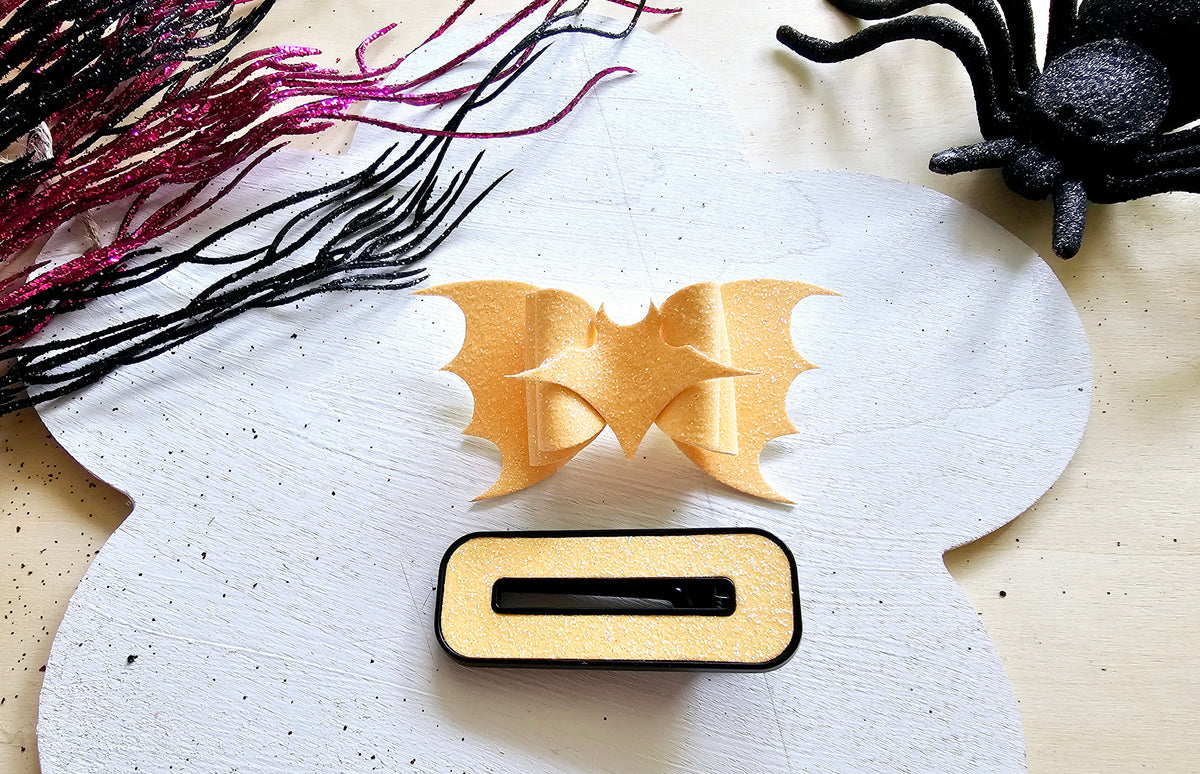 Cute glow in the dark bat hair tie for girls perfect for Halloween and trick-or-treating.