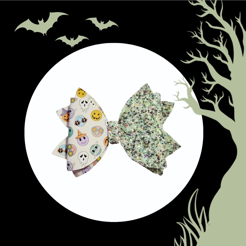 Groovy Halloween hair bow with glow-in-the-dark glitter and retro Halloween print.