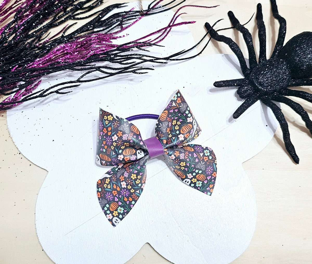 Handmade Halloween floral ponytail holder featuring a boutique faux leather design for girls.