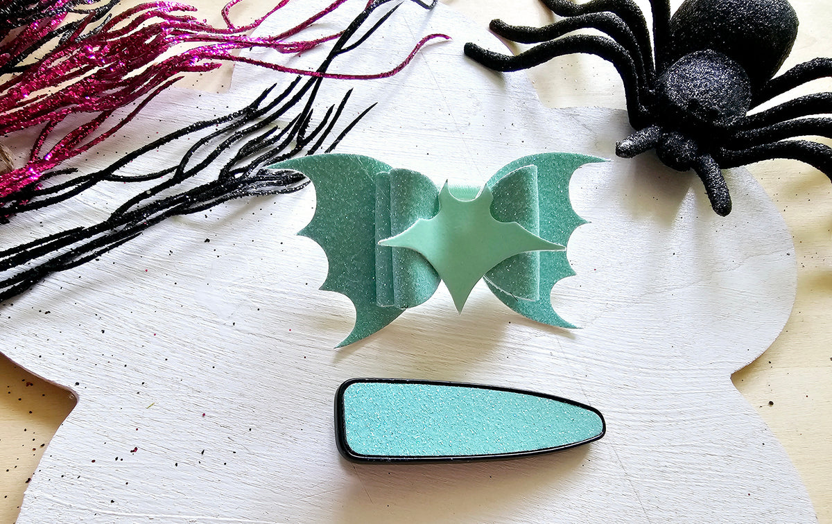 Cute glow in the dark bat hair tie for girls perfect for Halloween and trick-or-treating.