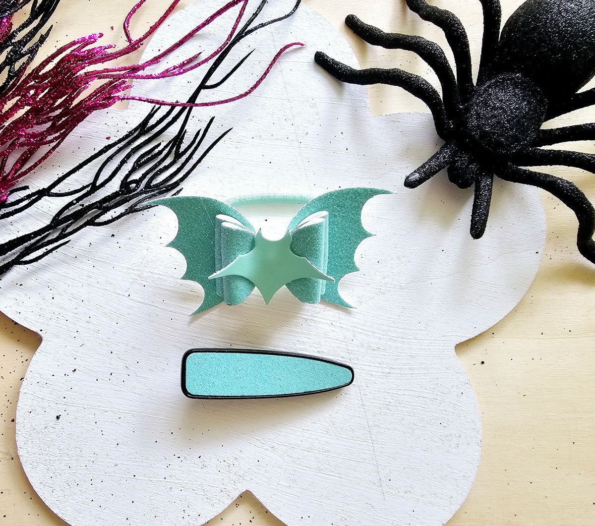 Cute glow in the dark bat hair tie for girls perfect for Halloween and trick-or-treating.