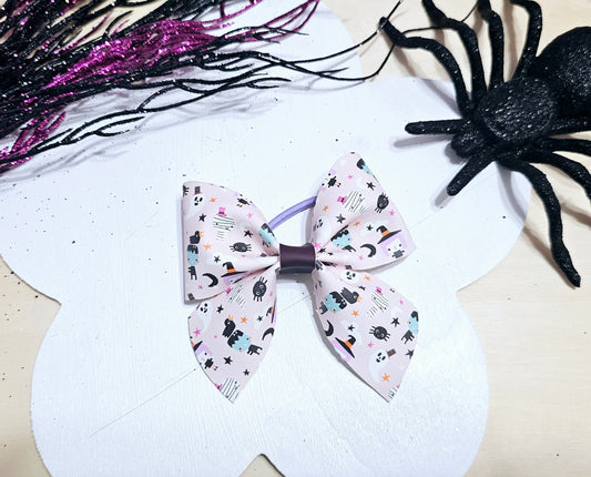 Handmade Halloween ponytail holder featuring a heat-changing faux leather design for girls.