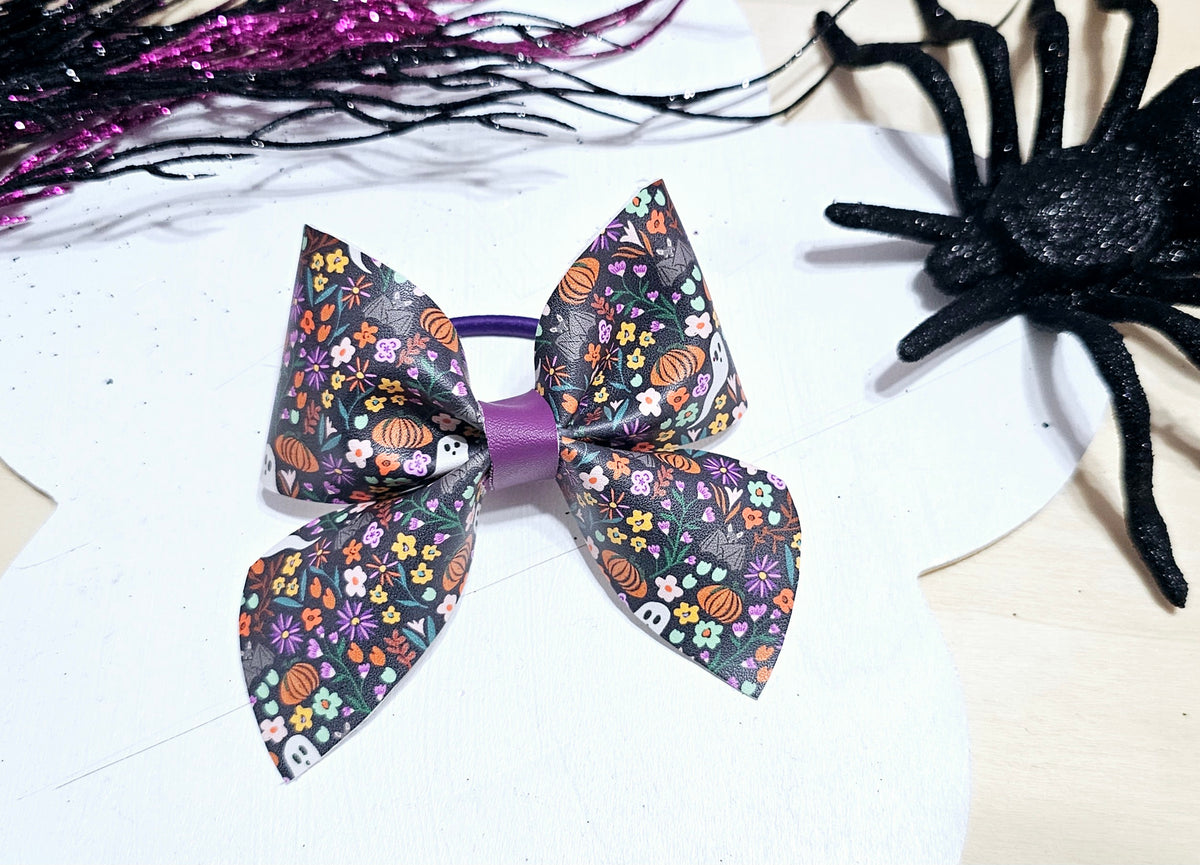 Boutique Halloween ponytail holder with a spooky floral print, perfect for fall and Halloween outfits.