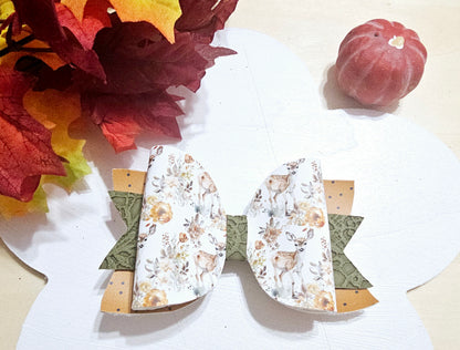 Handmade Oh Deer faux leather boutique hair bow featuring a woodland deer and floral design with fall colors.