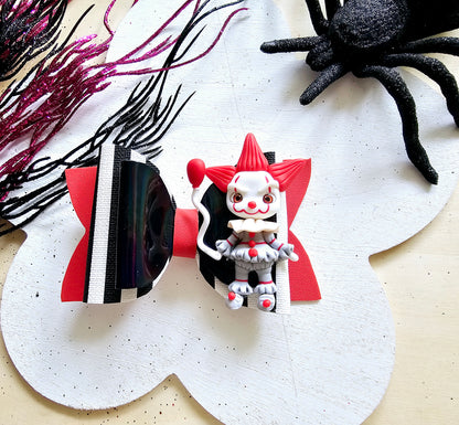 Handmade Scary Clown Halloween hair bow featuring glitter accents and a detailed creepy clown centerpiece for girls