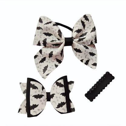 Handmade Bat Senses Halloween hair bow set featuring a spooky bat print and heat-changing material.