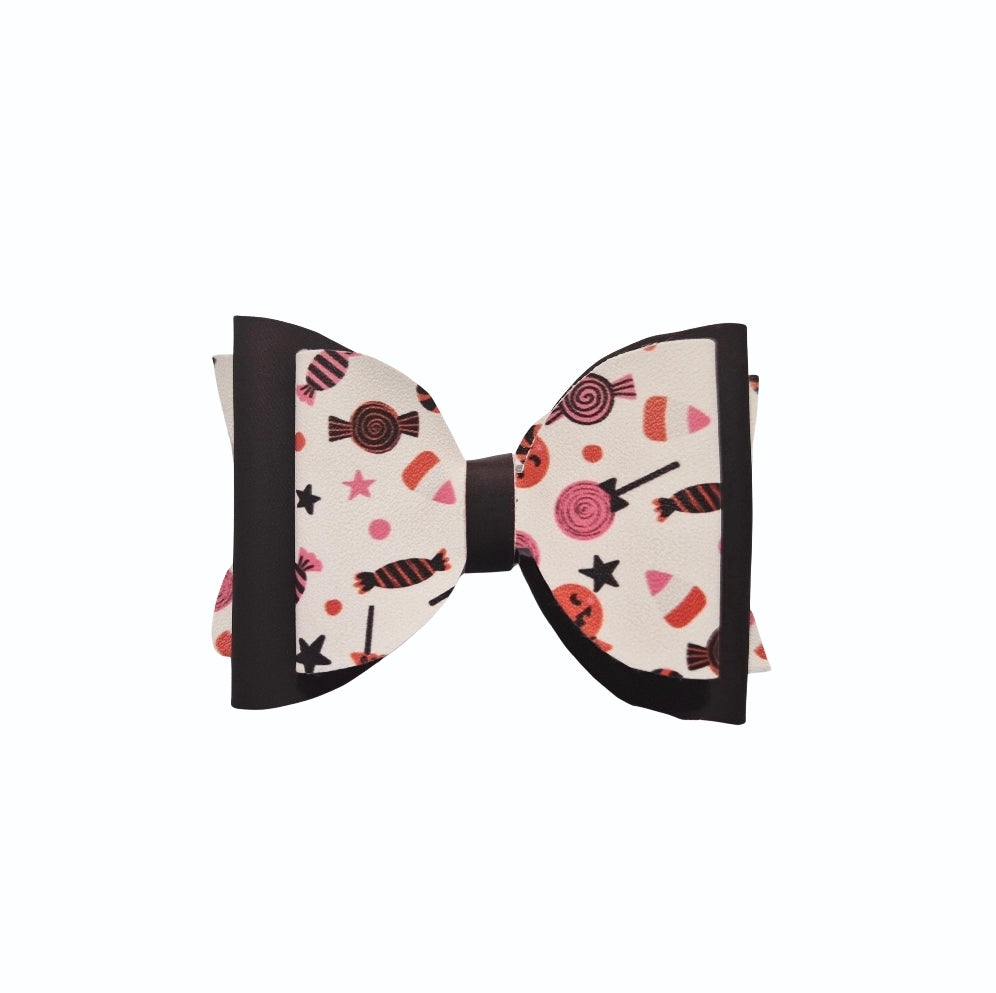 Boutique Halloween candy hair bow with heat changing material and faux leather accents