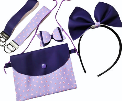Handmade pastel purple Halloween purse set with matching headband, mini hair bow, and wristlets featuring heat-changing fabric on a festive Halloween background.