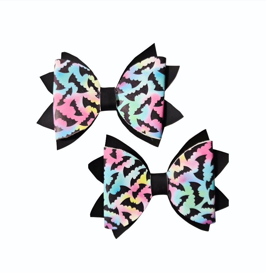Medium and mini pastel bat Halloween hair bow set with black accents.