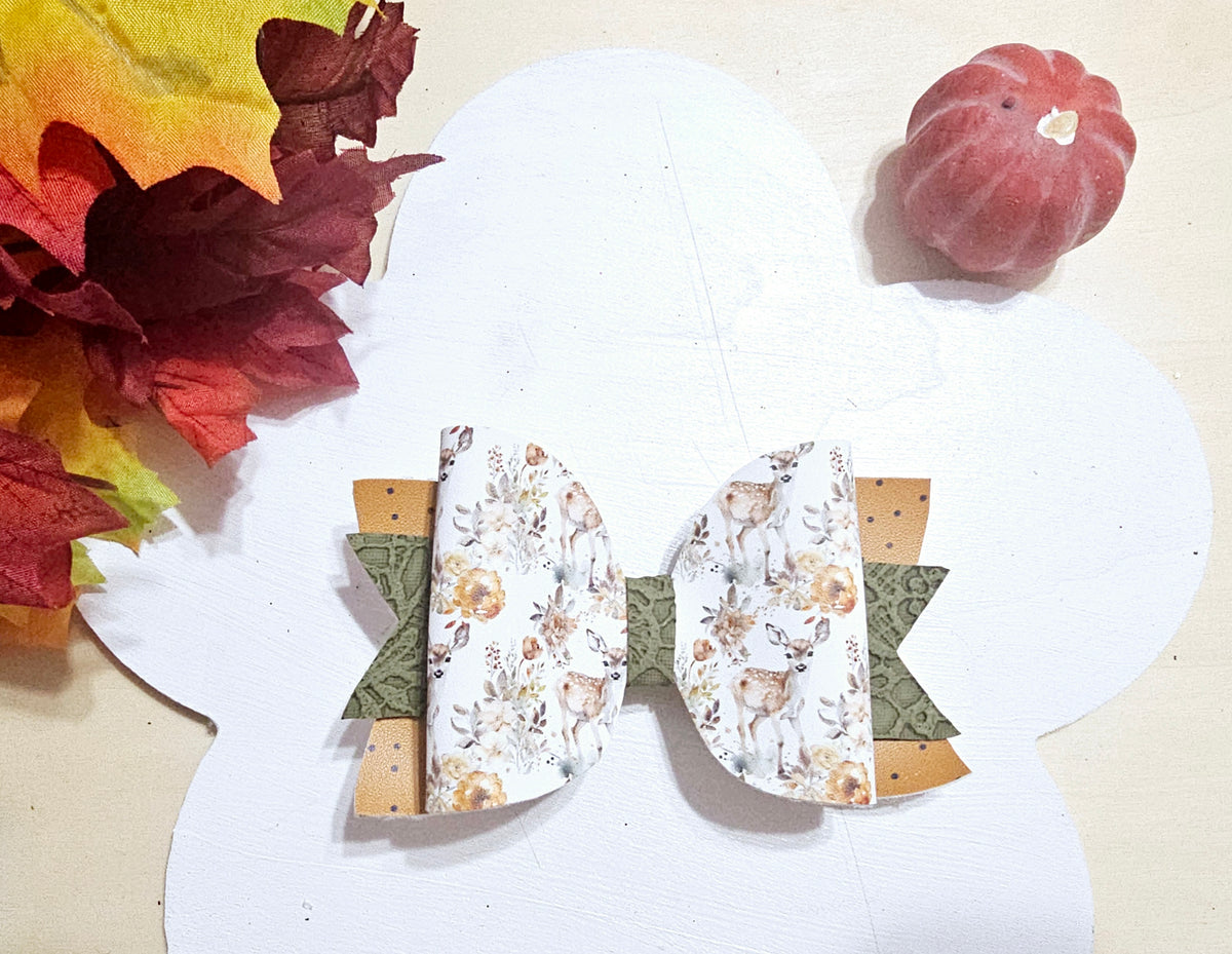 Handmade Oh Deer faux leather boutique hair bow featuring a woodland deer and floral design with fall colors.