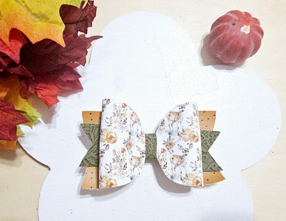 Handmade Oh Deer faux leather boutique hair bow featuring a woodland deer and floral design with fall colors.