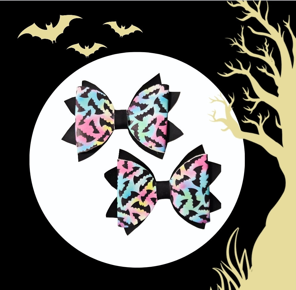 Pastel Halloween bat hair bows with colorful heat changing material and black accents.