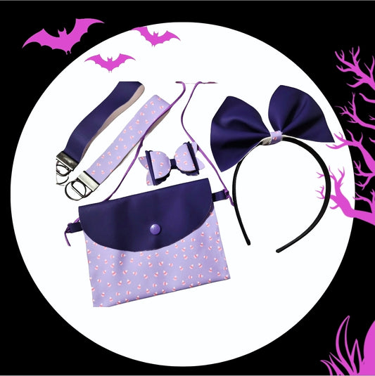 Handmade pastel purple Halloween purse set with matching headband, mini hair bow, and wristlets featuring heat-changing fabric on a festive Halloween background.