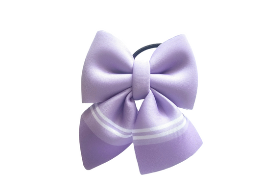 Handmade pastel purple crayon hair bow ponytail holder for girls, perfect for back-to-school outfits and the first day of school.