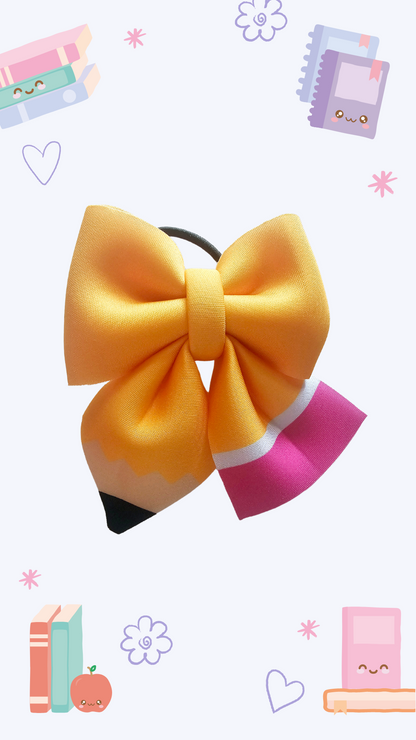 Handmade yellow pencil hair bow ponytail holder for girls, perfect for back-to-school outfits and the first day of school.