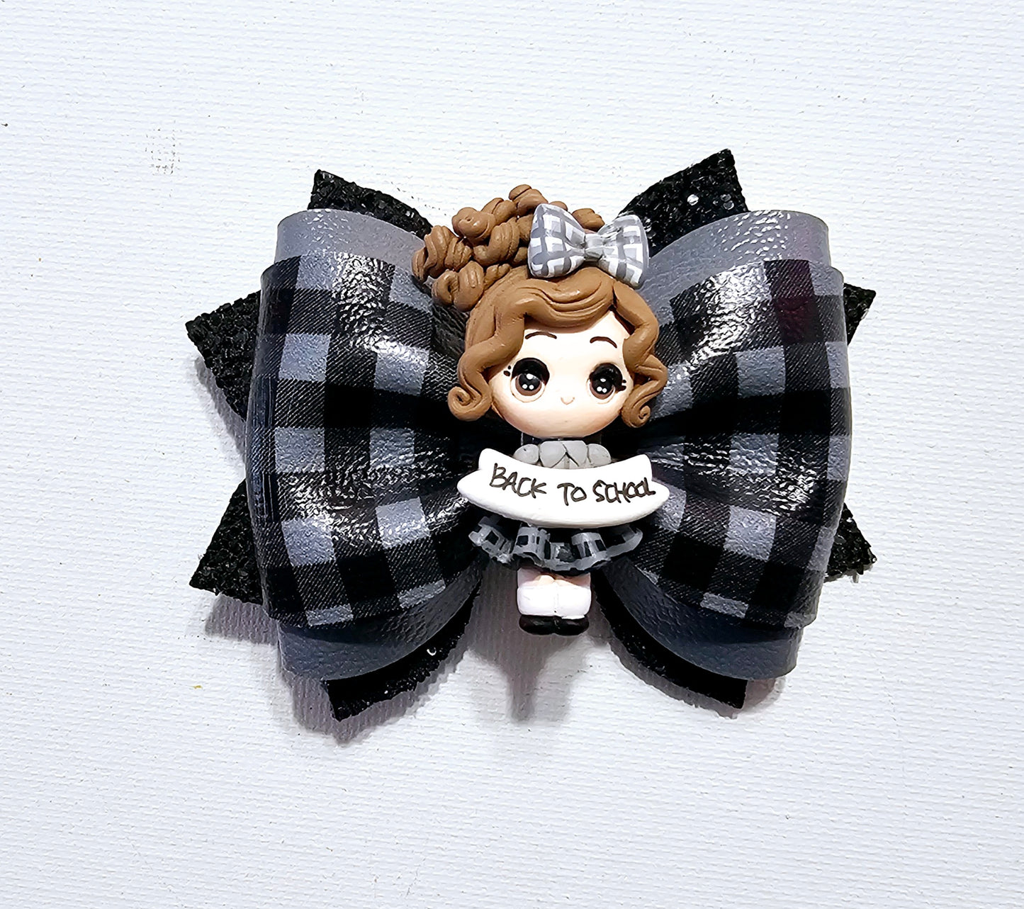 Handmade plaid school uniform hair bow for girls, perfect for back-to-school outfits, school uniforms, and picture day.