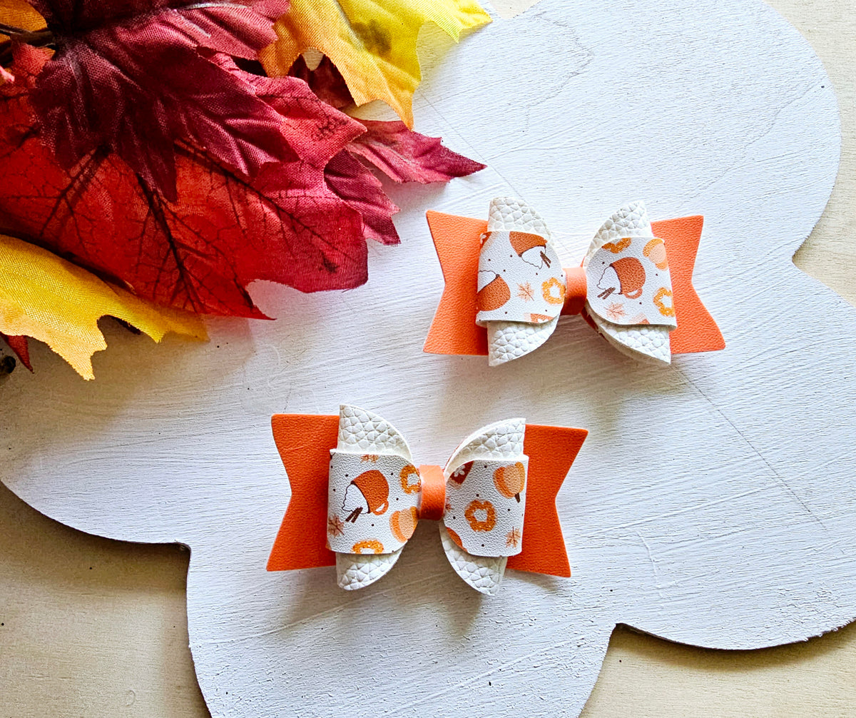 Handmade Pumpkin Spice faux leather hair bow set featuring two boutique bows for babies, toddlers, and girls.
